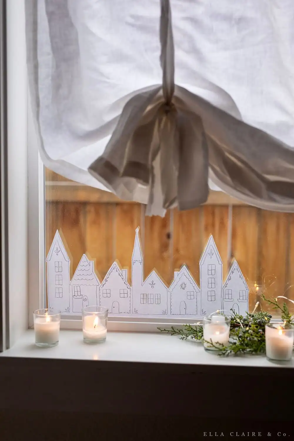 manualidades navideñas pueblo navideño en ventana